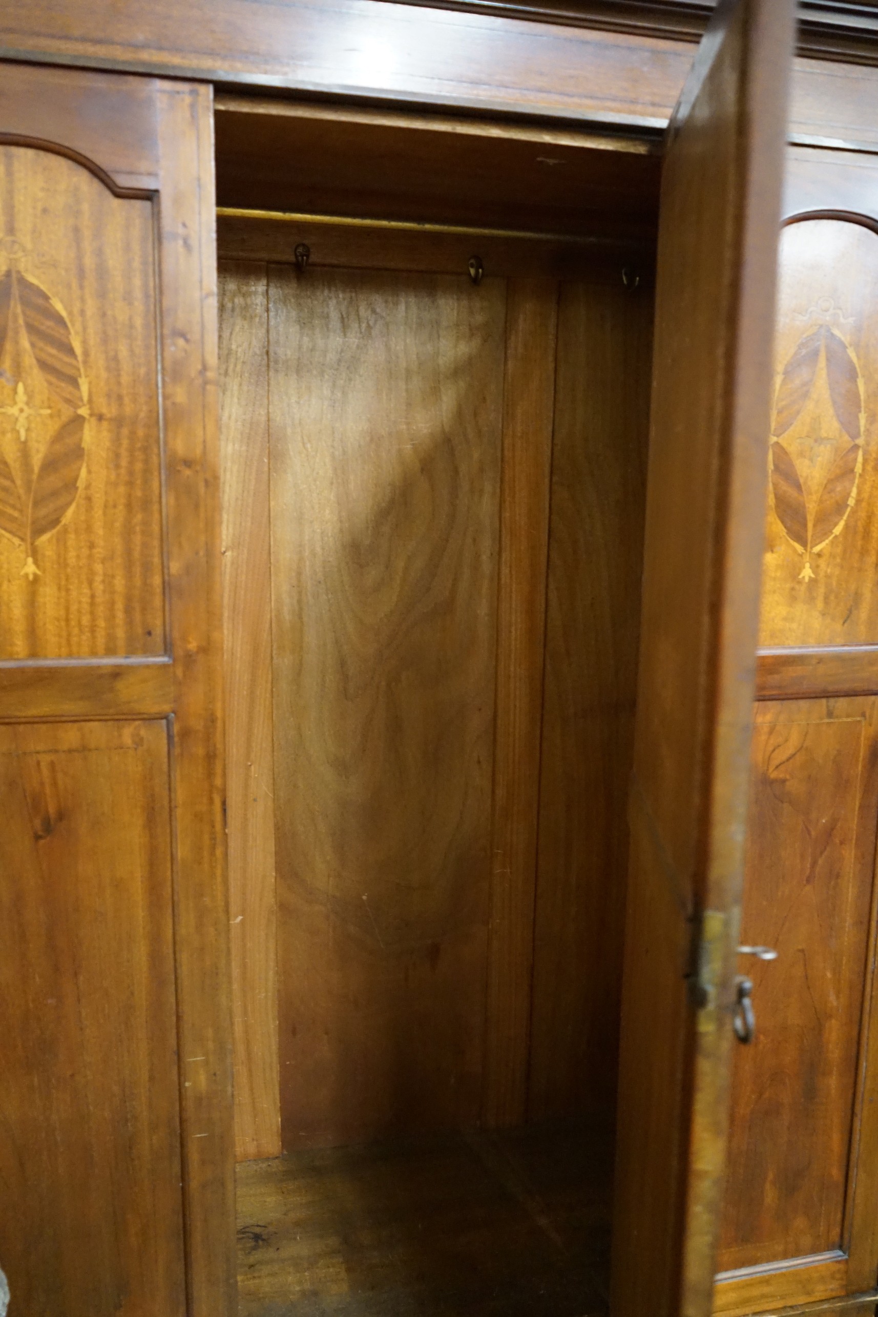 An Edwardian inlaid mahogany wardrobe, width 130cm, depth 50cm, height 200cm